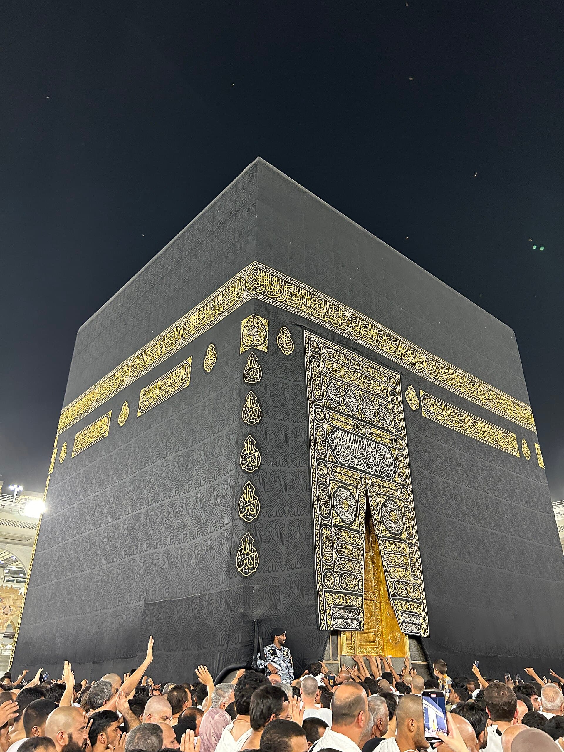 The Kaaba and its gold-threaded kiswah at night