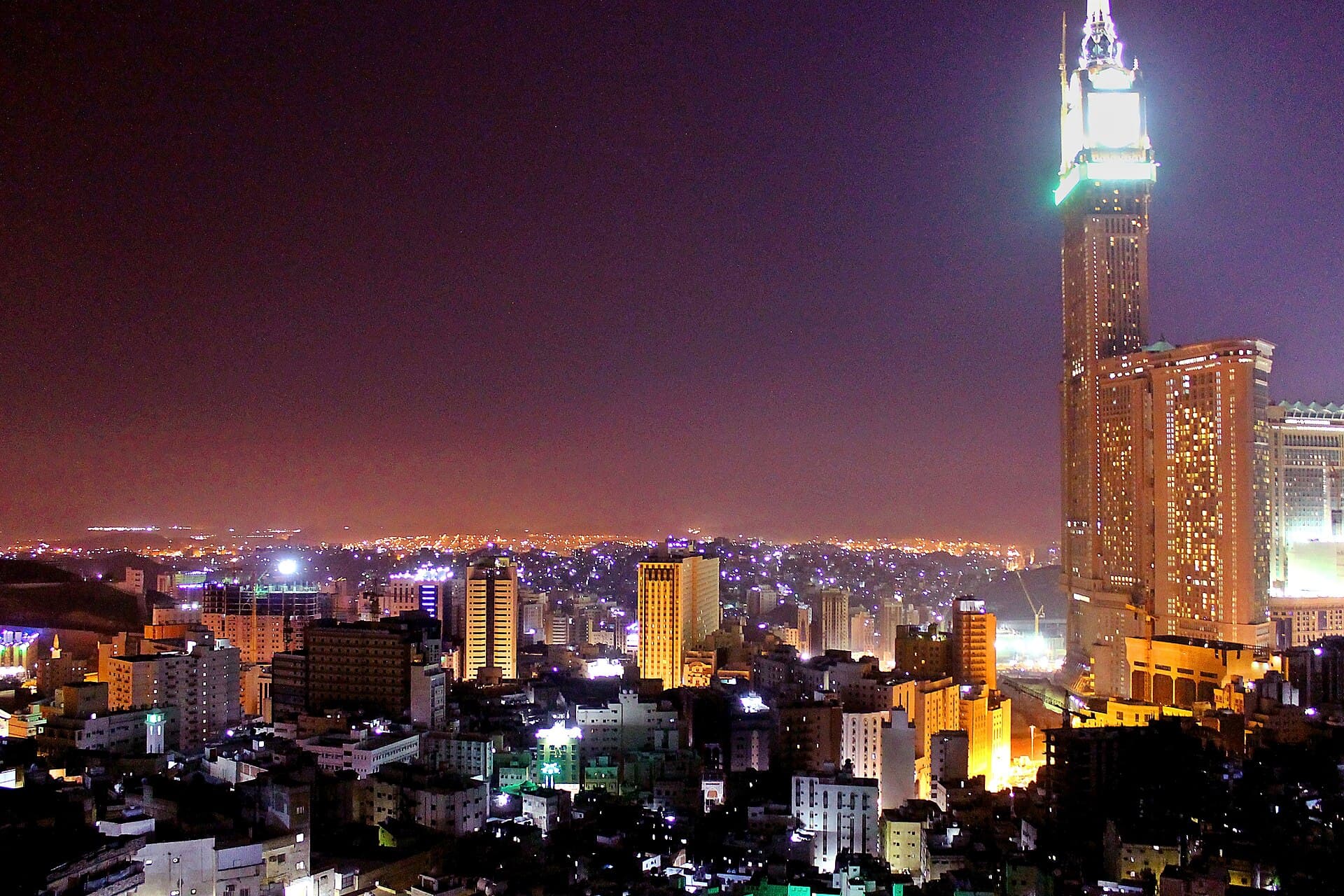 The Mecca clock tower rising over the city at night